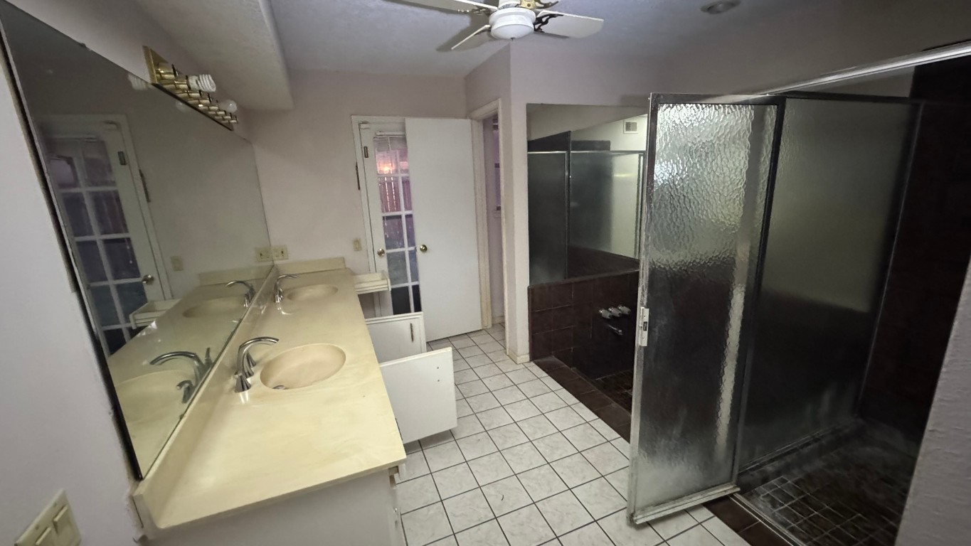 2162 Paso Rello Drive Houston, TX 77077 - Photo 19 of 32 a bathroom with a sink and mirror