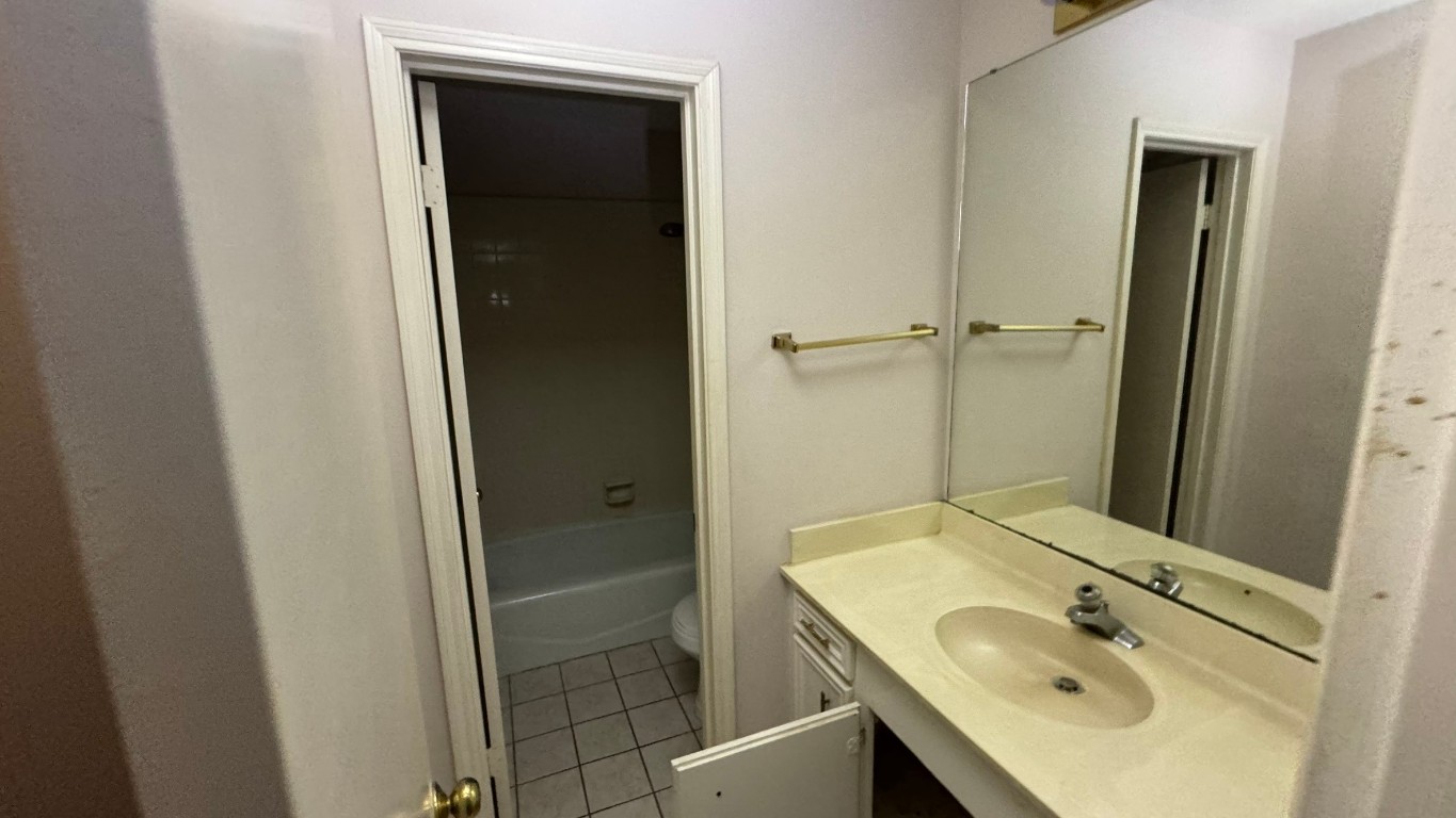 2162 Paso Rello Drive Houston, TX 77077 - Photo 23 of 32 a bathroom with a sink and a mirror
