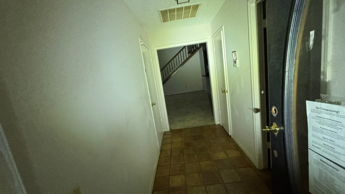 2162 Paso Rello Drive Houston, TX 77077 - Photo 6 of 32 a view of a bathroom from a hallway