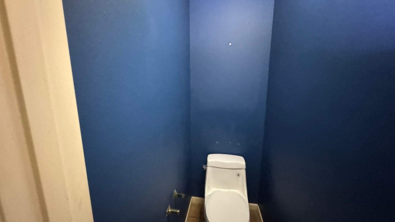 2162 Paso Rello Drive Houston, TX 77077 - Photo 8 of 32 a white toilet sitting next to a white wall