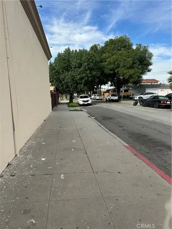 a view of street with parked cars