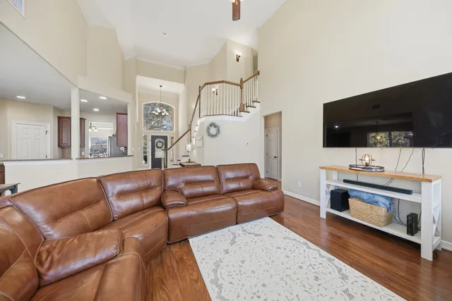 a view of a house with a yard and sitting area