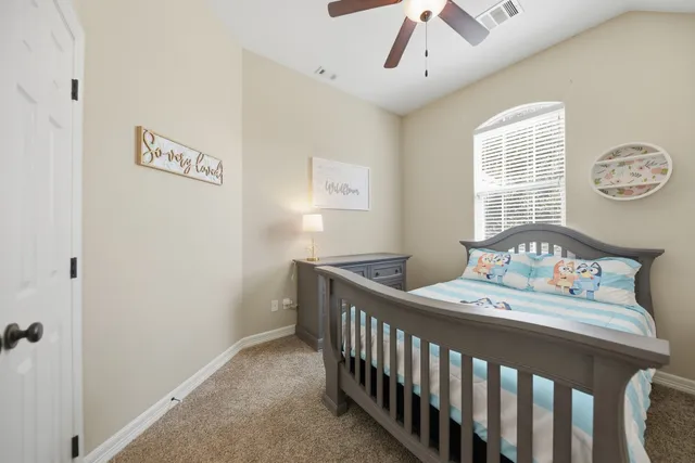 a bedroom with a bed and hallway