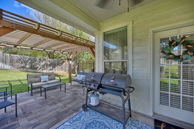 a view of room with window and ceiling fan