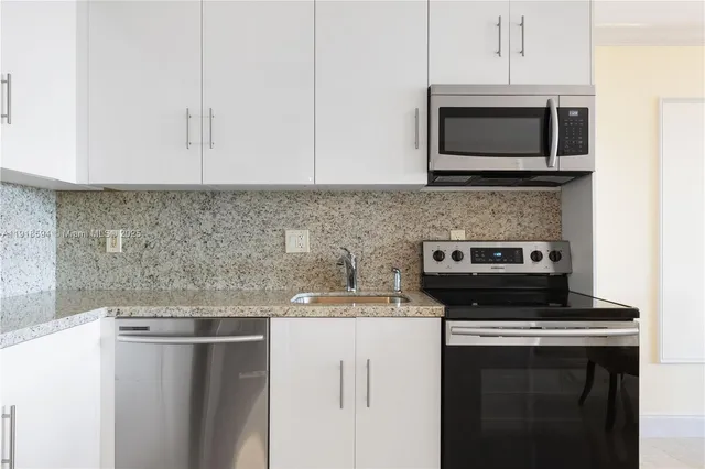 a kitchen with a stove and a microwave