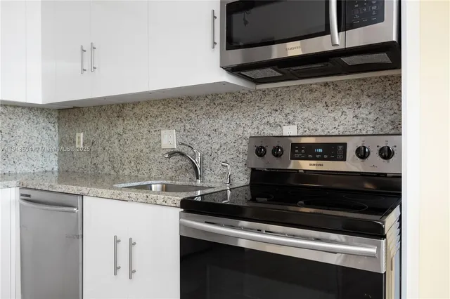 a close view of a stove top oven sitting inside of a kitchen
