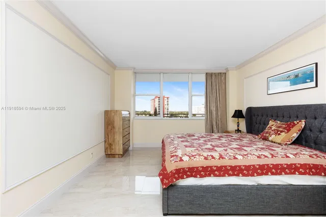 a bedroom with a bed and chair