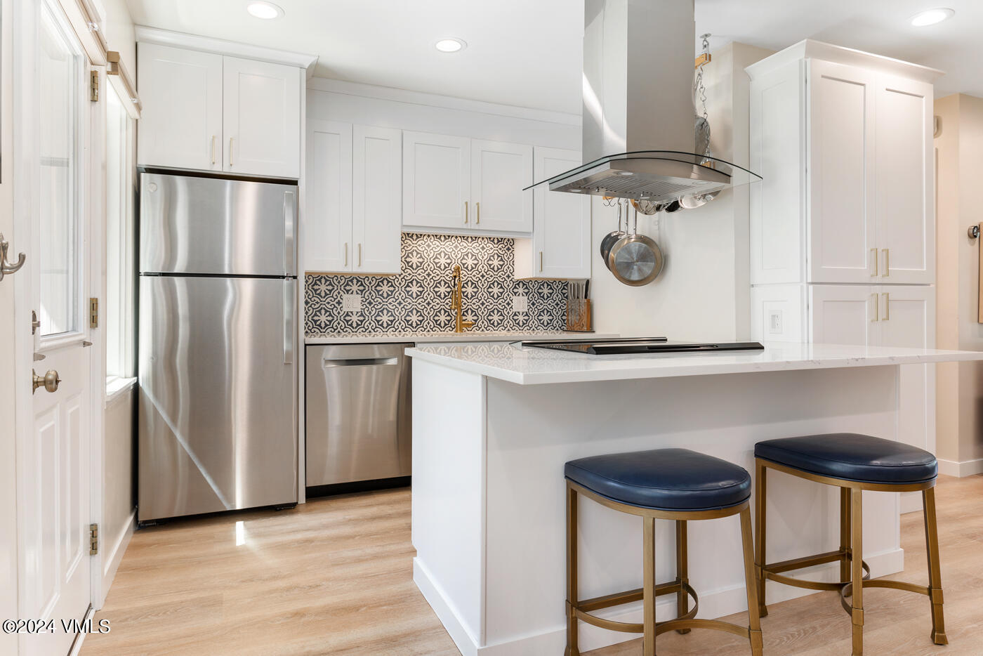 2199 Chamonix Lane, Unit 9 Vail, CO 81657 - Photo 13 of 24 a kitchen with stainless steel appliances granite countertop a refrigerator and a stove top oven
