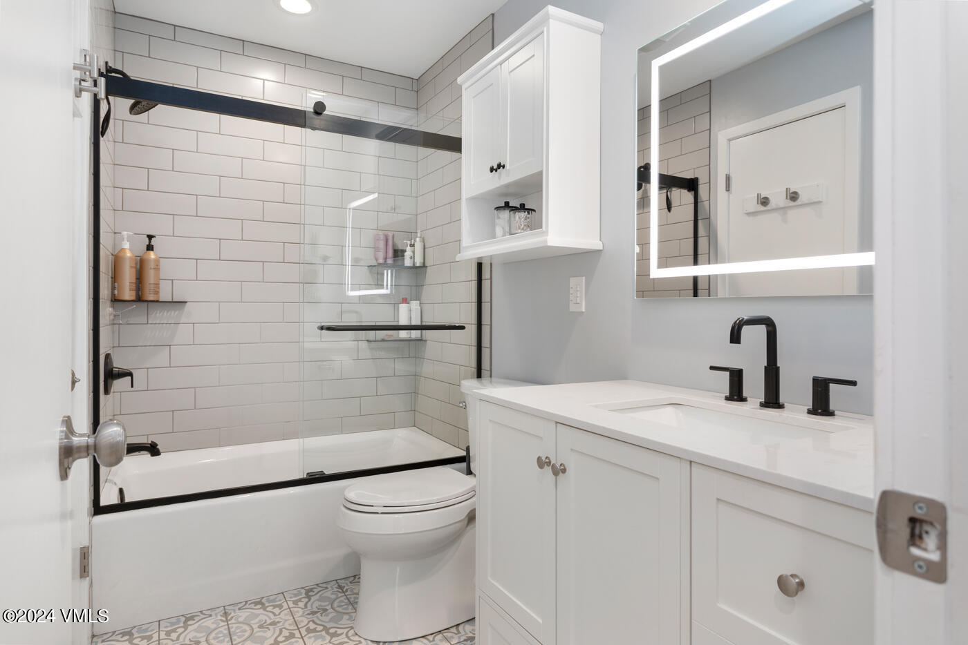 2199 Chamonix Lane, Unit 9 Vail, CO 81657 - Photo 19 of 24 a bathroom with a shower sink vanity mirror and toilet