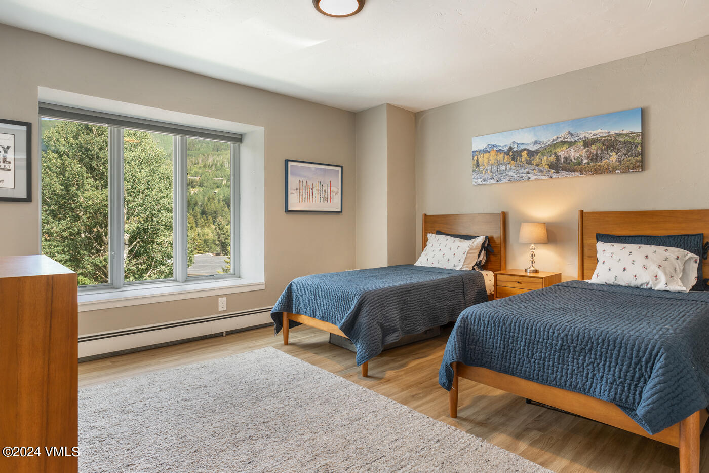 2199 Chamonix Lane, Unit 9 Vail, CO 81657 - Photo 20 of 24 a bedroom with two beds and a large window