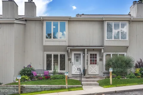 a view of a town with mountains in the background