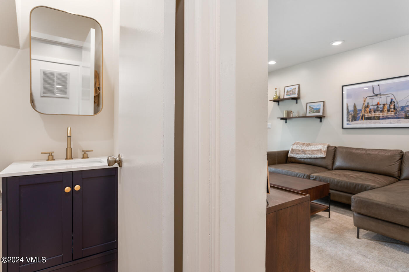 2199 Chamonix Lane, Unit 9 Vail, CO 81657 - Photo 5 of 24 a living room with furniture and a mirror