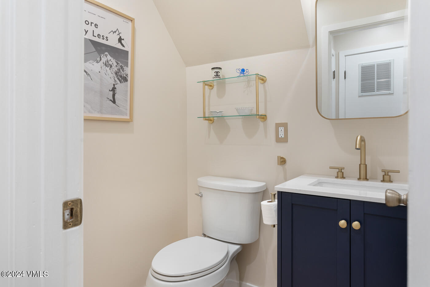 2199 Chamonix Lane, Unit 9 Vail, CO 81657 - Photo 6 of 24 a bathroom with a toilet sink and mirror