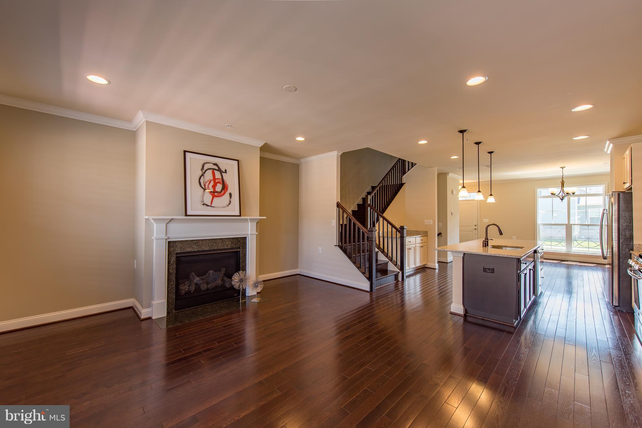1163 Holden Road Frederick, MD 21701 - Photo 11 of 30 a living room with furniture and a wooden floor