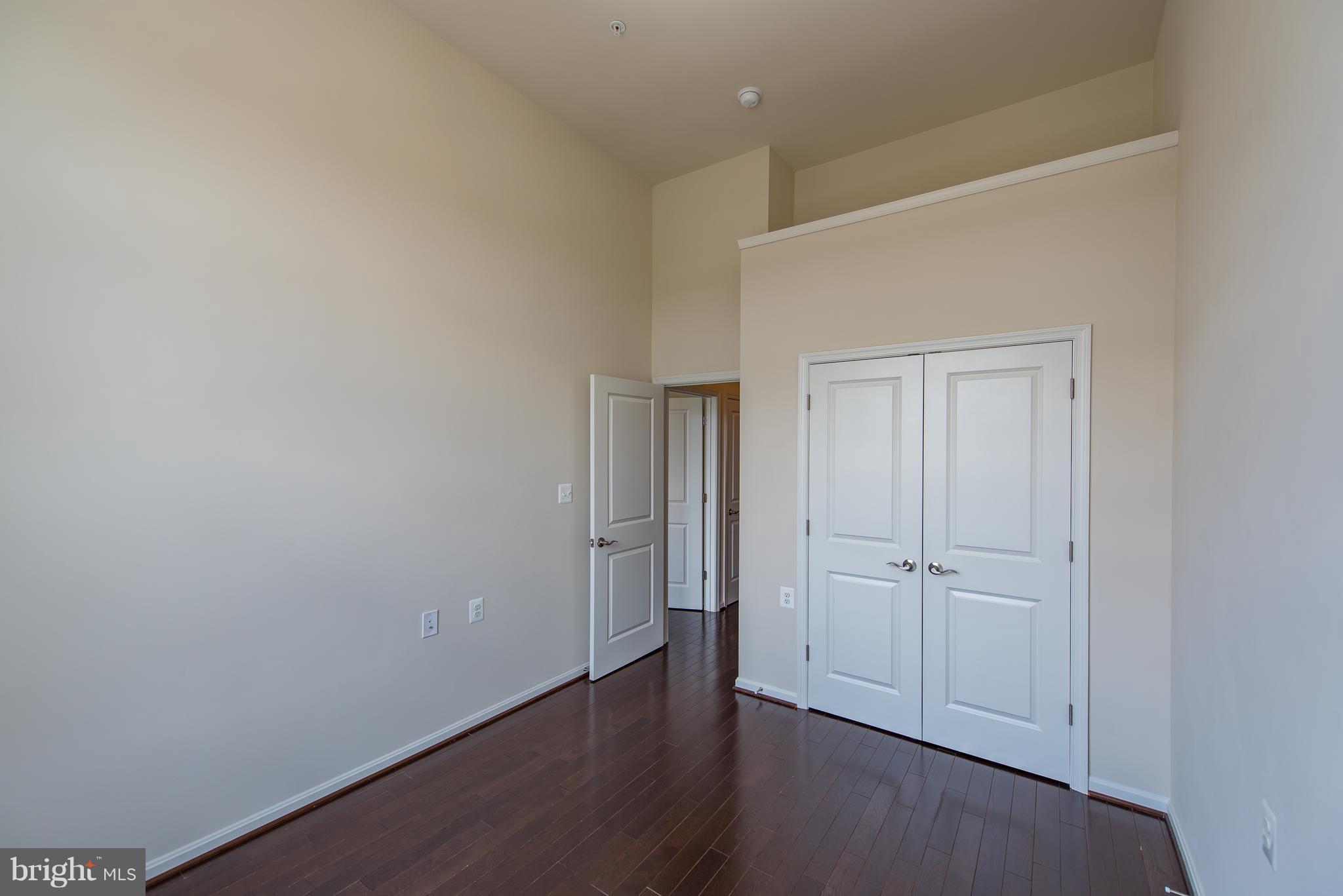 1163 Holden Road Frederick, MD 21701 - Photo 19 of 30 a view of an empty room with wooden floor