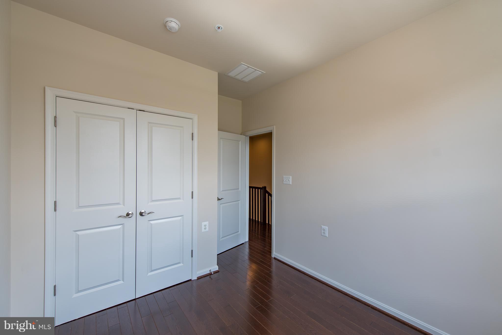 1163 Holden Road Frederick, MD 21701 - Photo 22 of 30 an empty room with wooden floor