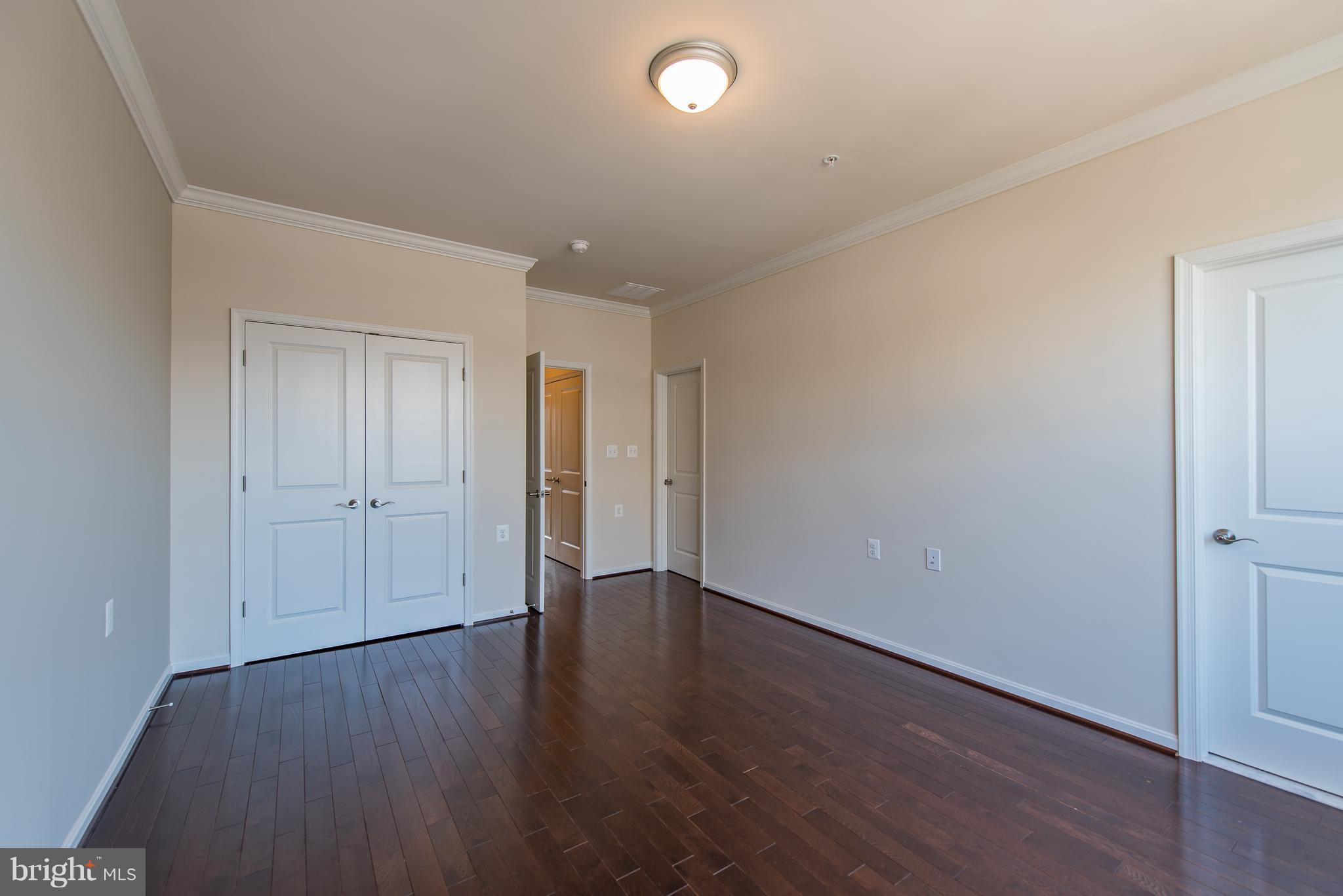 1163 Holden Road Frederick, MD 21701 - Photo 23 of 30 a view of an empty room with wooden floor