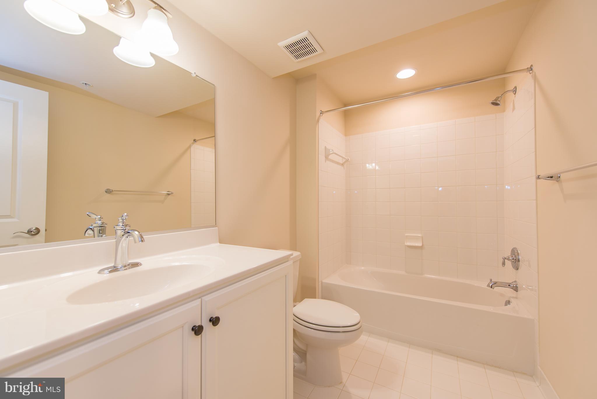 1163 Holden Road Frederick, MD 21701 - Photo 27 of 30 a bathroom with a sink a toilet and shower