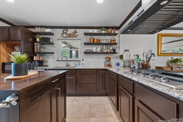 a kitchen with a sink counter top space and appliances