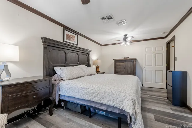 a bedroom with a bed and a dresser