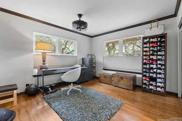 a room with lots of cabinet and a rug