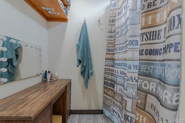 a balcony with table and chairs