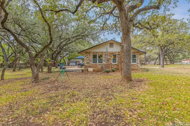 a house with trees in front of it