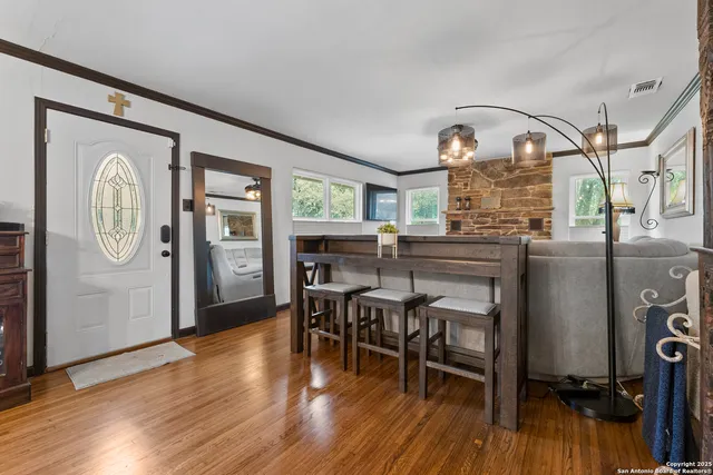 a view of a dining room with furniture window and wooden floor
