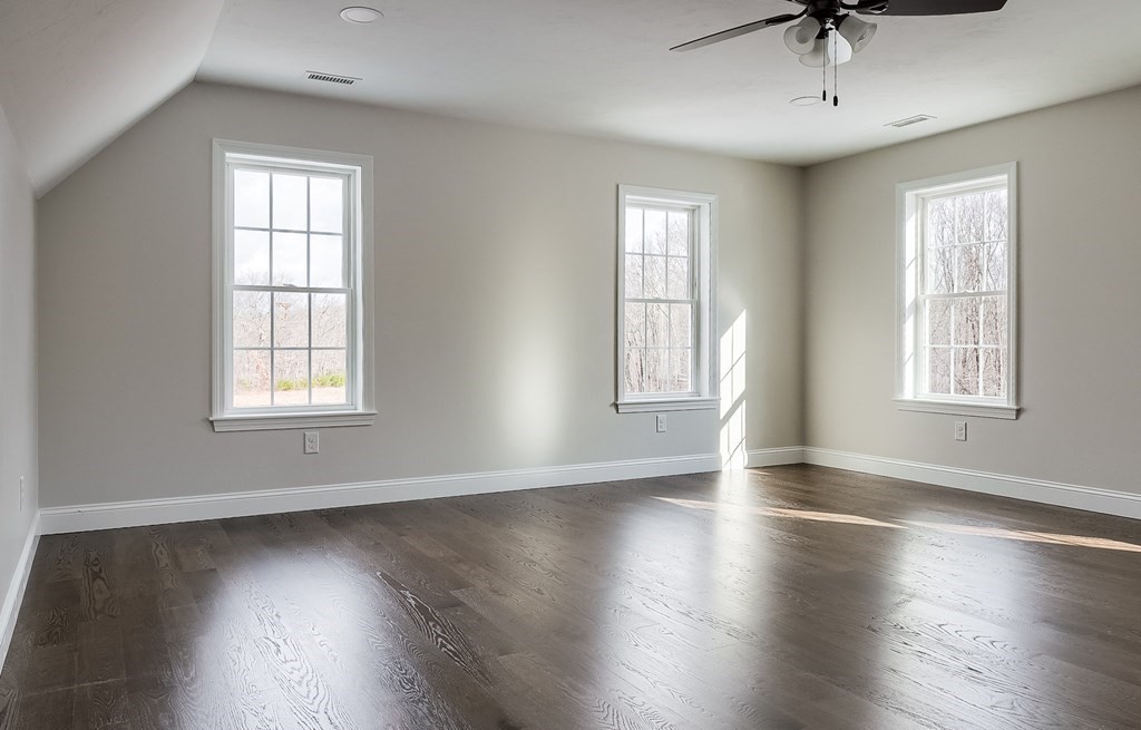 231 Podunk Road Sturbridge, MA 01566 - Photo 18 of 42 a view of an empty room with wooden floor and a window