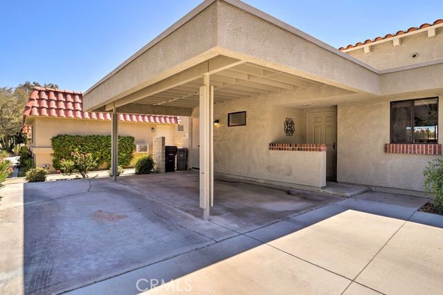 77313 Preston Trail Palm Desert, CA 92211 - Photo 11 of 15 a view of a house with a patio