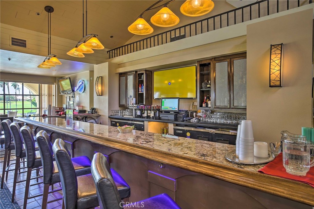 77313 Preston Trail Palm Desert, CA 92211 - Photo 15 of 15 a kitchen with stainless steel appliances granite countertop a sink and a dishwasher