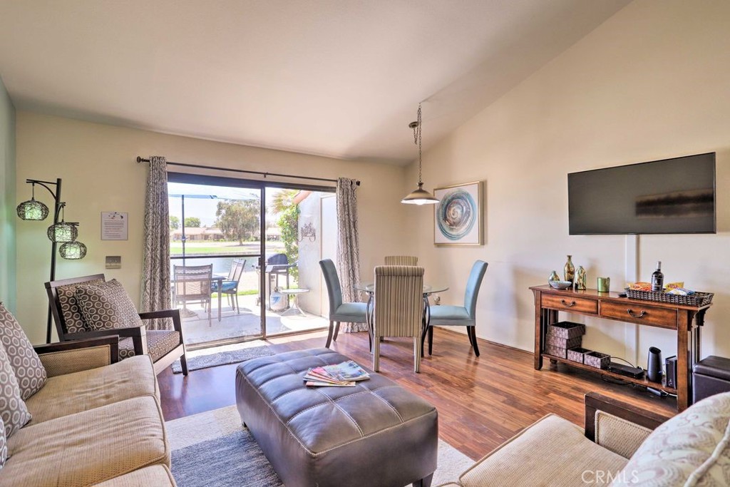 77313 Preston Trail Palm Desert, CA 92211 - Photo 3 of 15 a living room with furniture and a flat screen tv