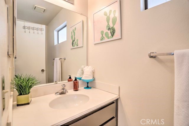 77313 Preston Trail Palm Desert, CA 92211 - Photo 10 of 15 a bathroom with a sink a vanity and a mirror