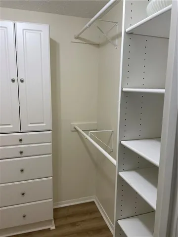 a view of an empty walk in closet