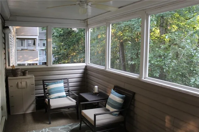 a view of a two room with furniture window and outside view