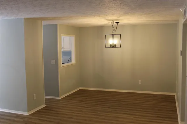 a view of a room with wooden floor and staircase