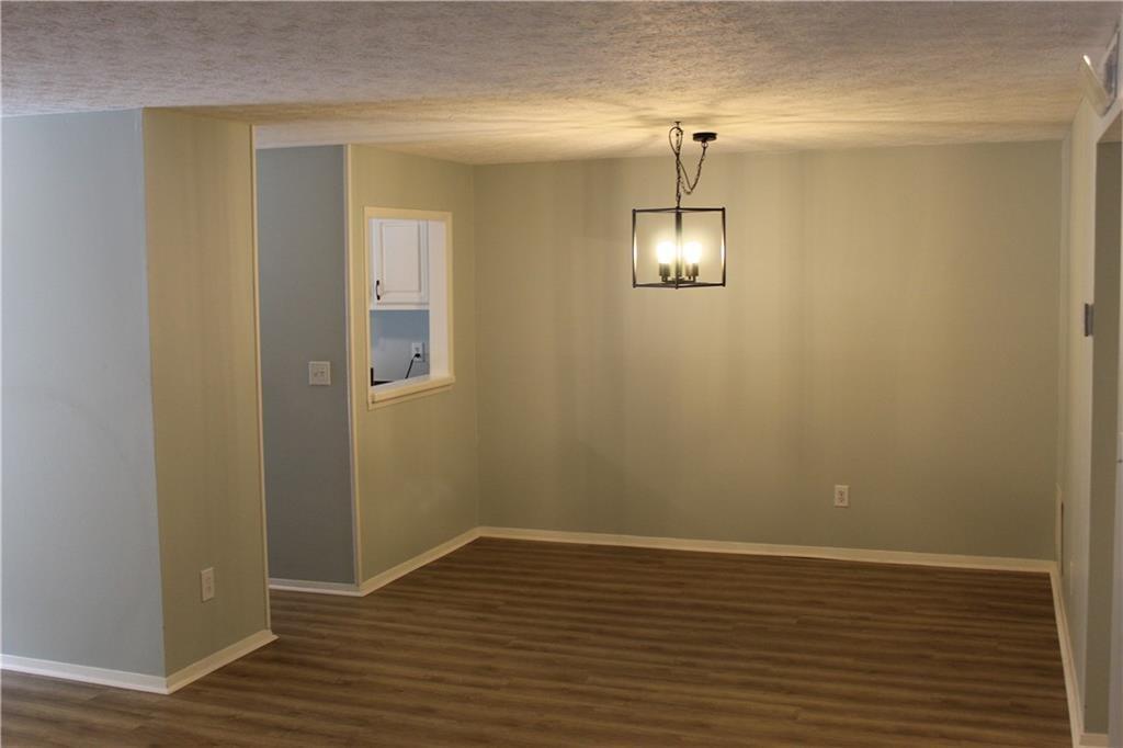 1508 Wynnes Ridge Circle Marietta, GA 30067 - Photo 8 of 15 a view of a room with wooden floor and staircase