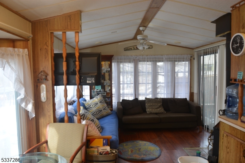 42 Elm Village Vernon, NJ 07461 - Photo 13 of 33 a living room with furniture and a large window