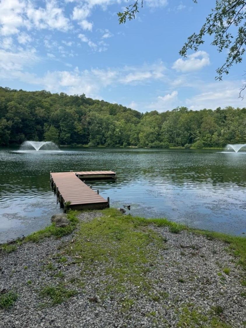 42 Elm Village Vernon, NJ 07461 - Photo 30 of 33 a view of a lake with a yard
