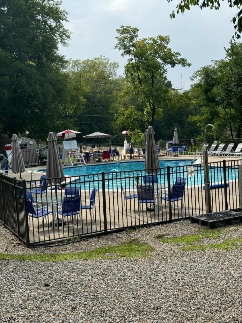 42 Elm Village Vernon, NJ 07461 - Photo 32 of 33 a view of a fence with a bench