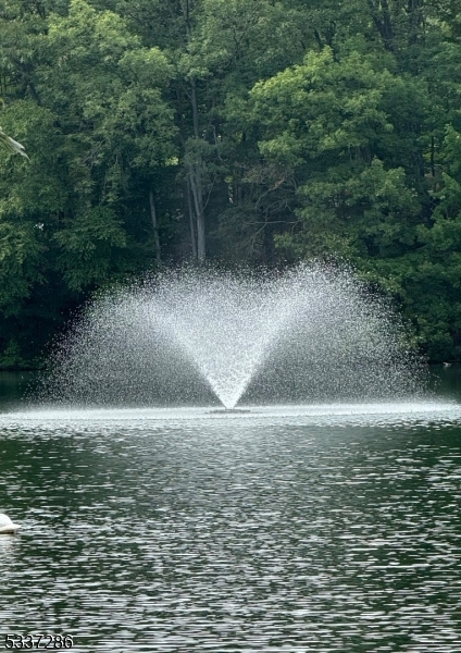 42 Elm Village Vernon, NJ 07461 - Photo 33 of 33 a view of a swimming pool with a yard