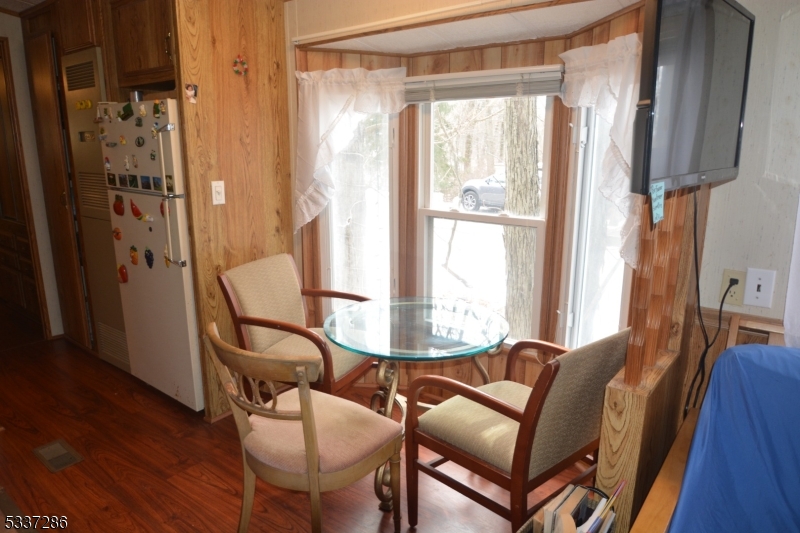 42 Elm Village Vernon, NJ 07461 - Photo 7 of 33 a view of a dining room with furniture and a window