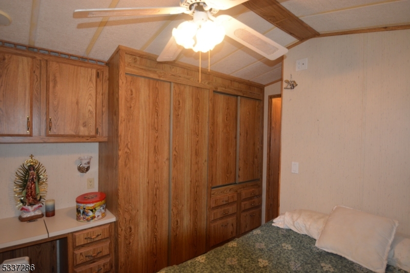 42 Elm Village Vernon, NJ 07461 - Photo 9 of 33 a bathroom with a sink and a mirror