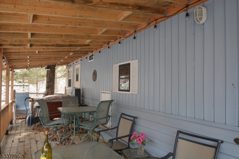 42 Elm Village Vernon, NJ 07461 - Photo 10 of 33 a view of a dining room with furniture window and outside view
