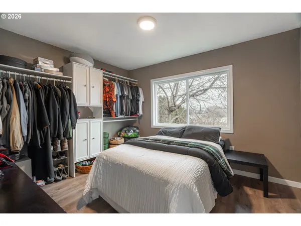 a bed room with a bed and a window