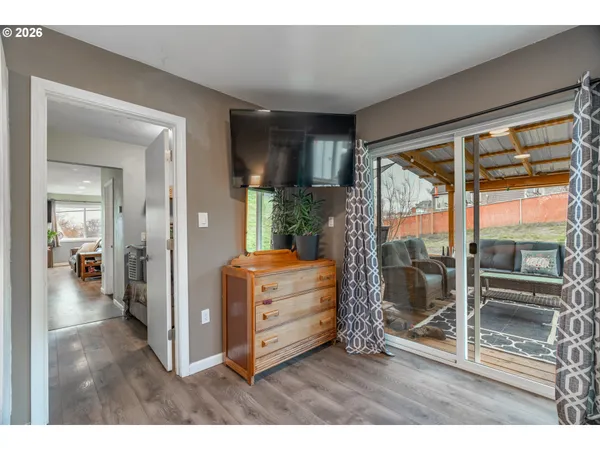 a room with furniture and a floor to ceiling window