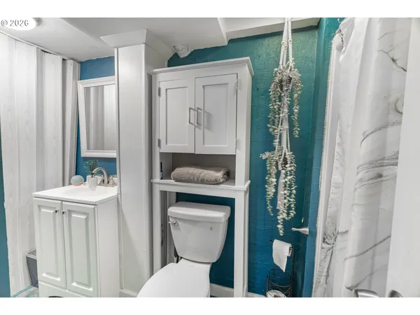 a bathroom with a toilet and a sink