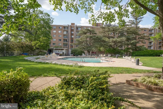 a view of a swimming pool and a yard
