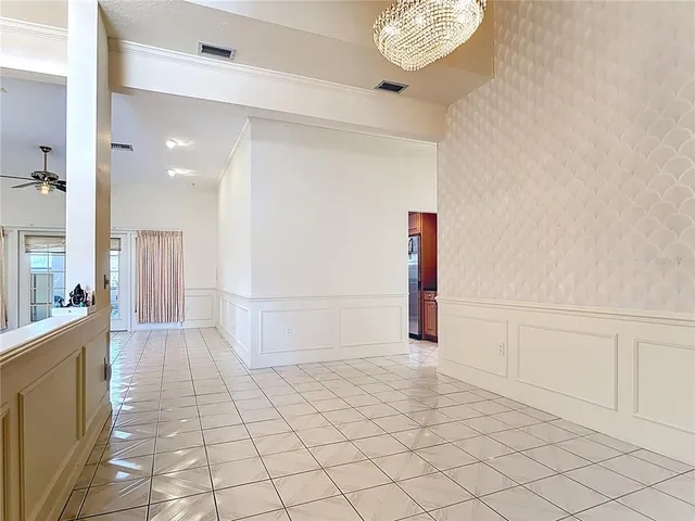 a bed room with a bed and a large mirror