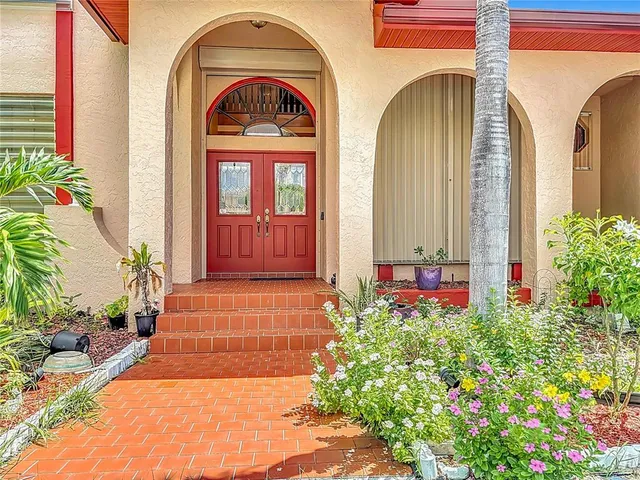 a view of a livingroom with furniture and stairs